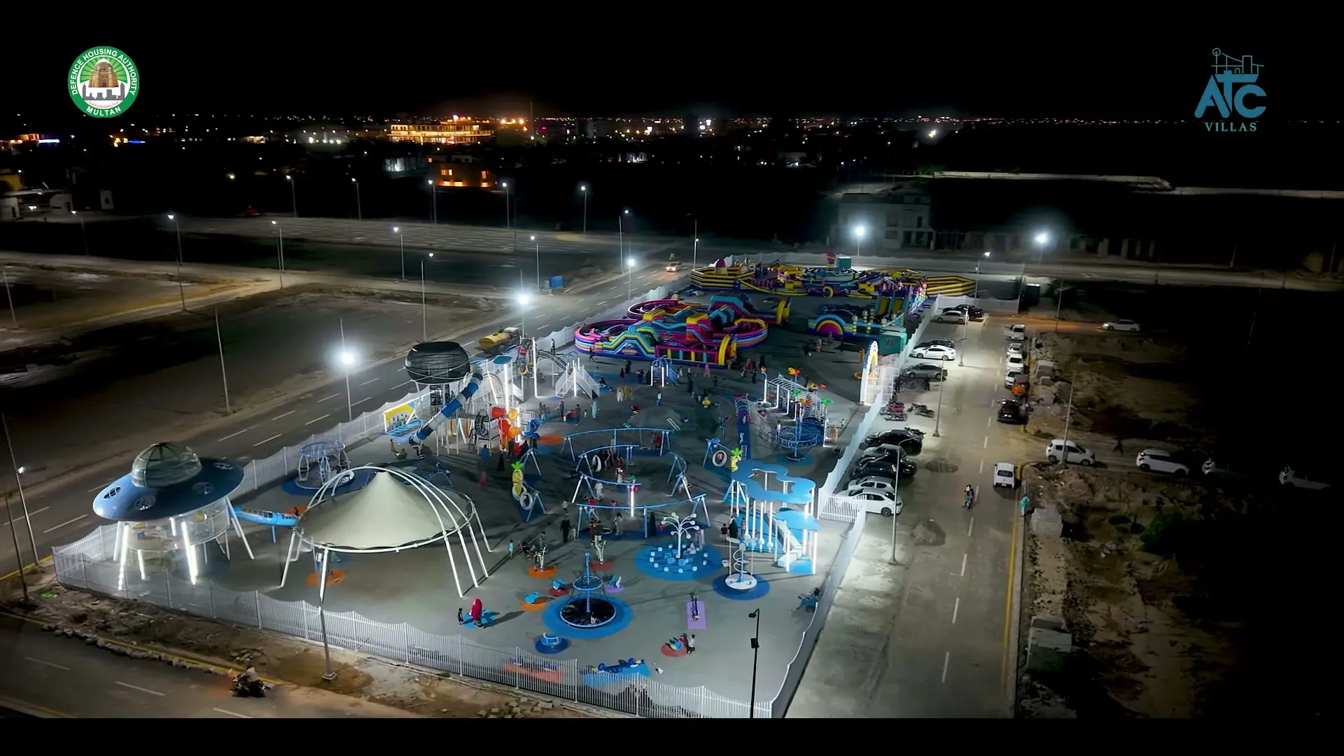 The ATC Villas amusement park operating at night with visitors, August 2026